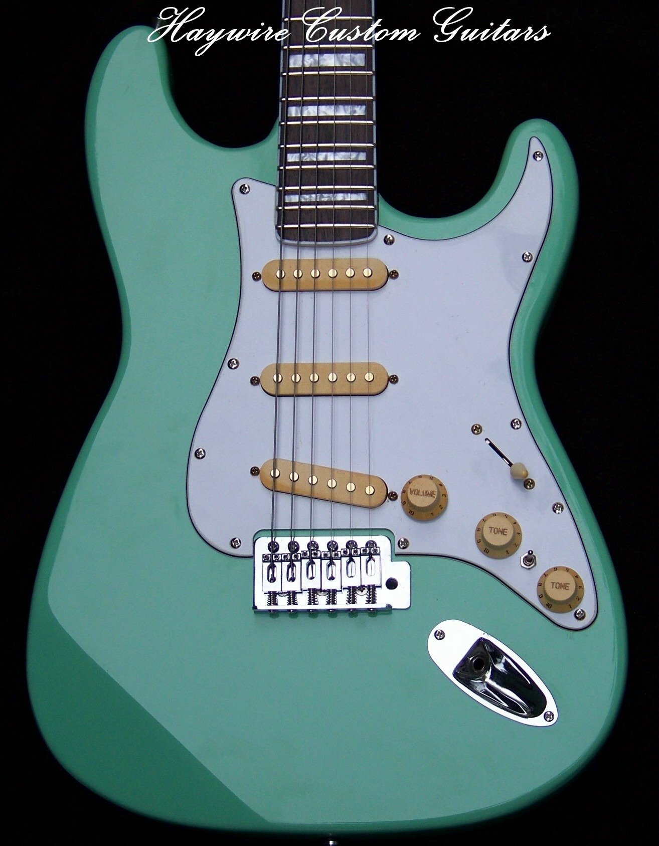 image Haywire Custom Guitars Surf Green with Bound Block Inlay neck with aged pickups and knobs.