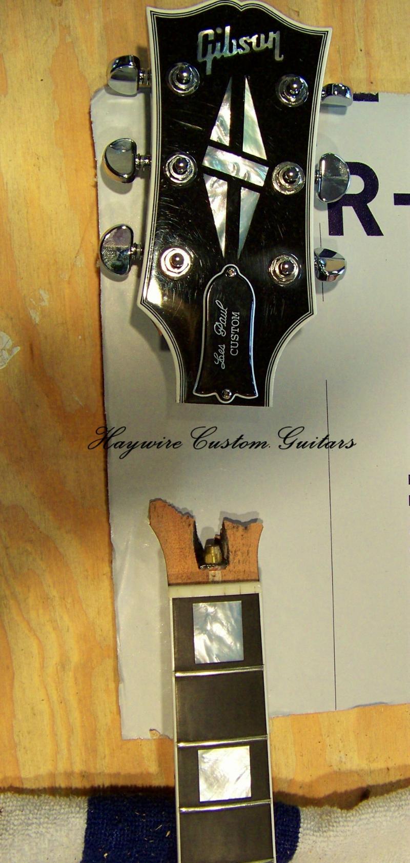 image of broken Gibson Les Paul guitar headstock in Haywire Custom Guitars Shop for repair